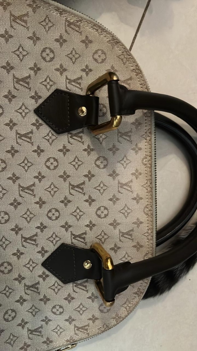 Bolso Louis Vuitton Mini Lin Alma Haut y Portacosmeticos